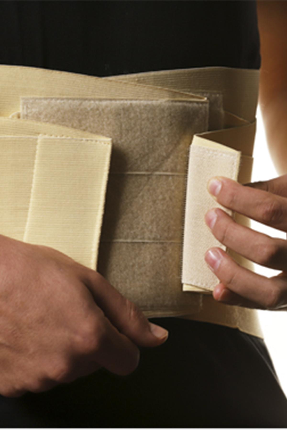 Elastic bandage for fixing the lumbar spine with rigid inserts
